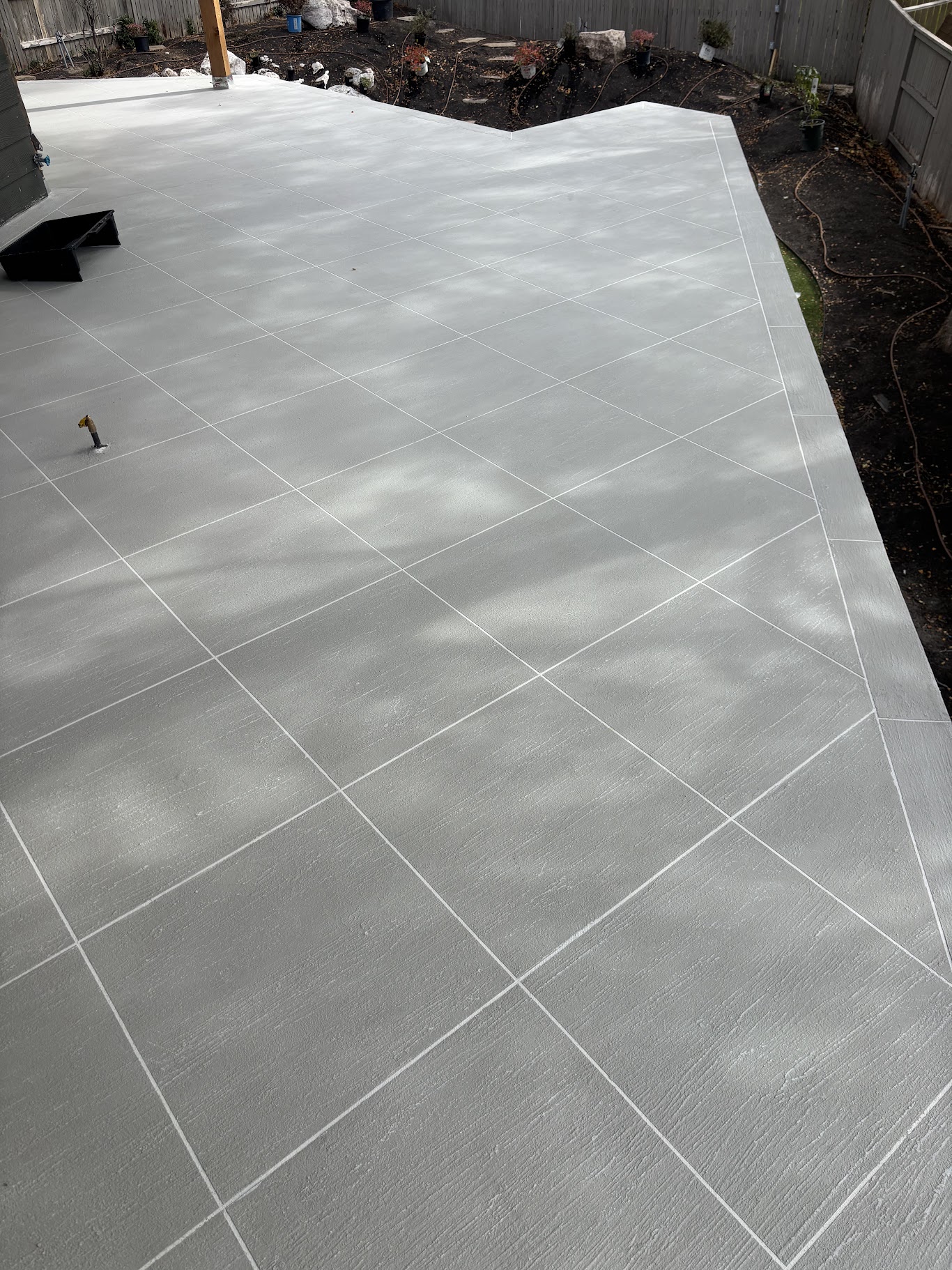 Large gray waterproof deck with diamond tile layout