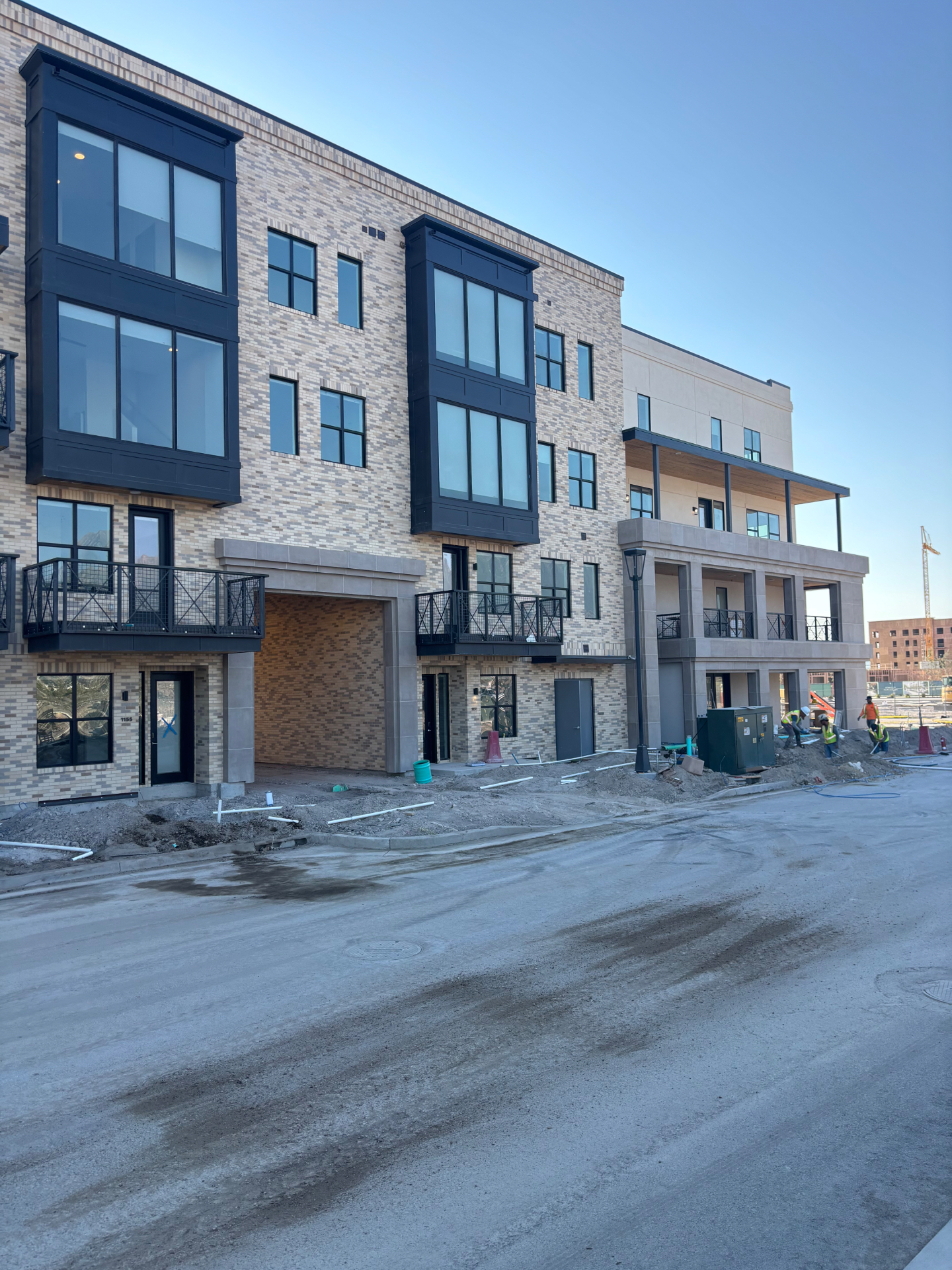 Multi-family brick and stone masonry building under construction