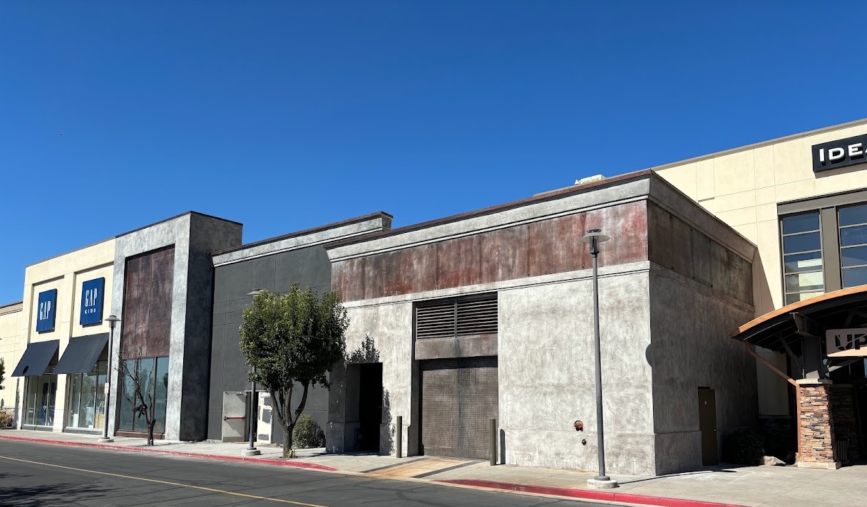 Commercial retail building with troweled concrete-look stucco finish