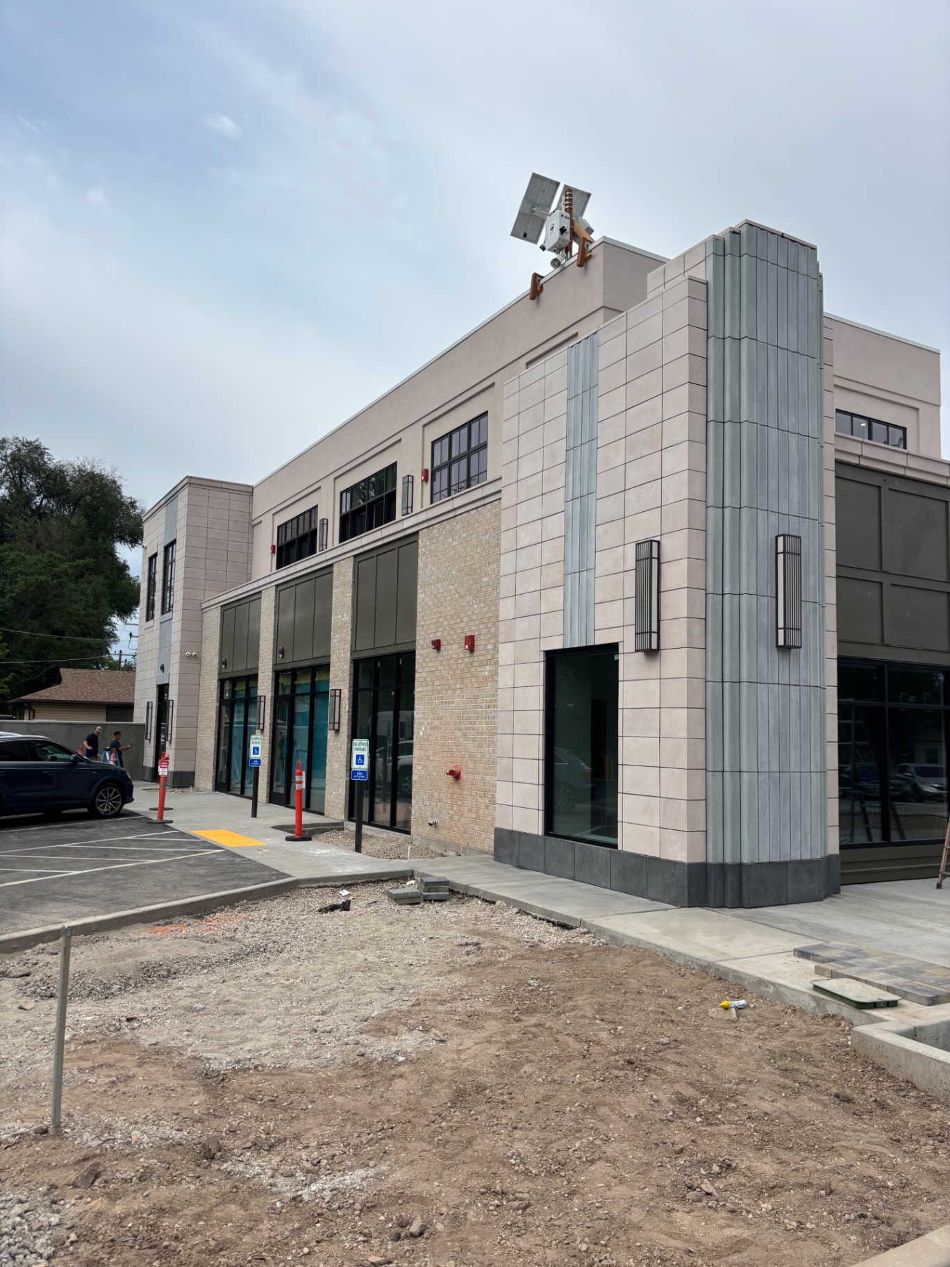 Commercial building with cast stone panels and brick masonry